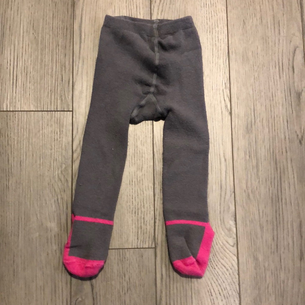 Girl size 24 months footed leggings in good used condition